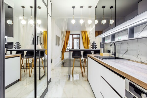 Luxury Studio Suite, Partial Sea View | Living area | 43-inch Smart TV with digital channels, Netflix, streaming services