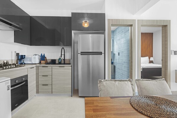 Fridge, microwave, stovetop, coffee/tea maker