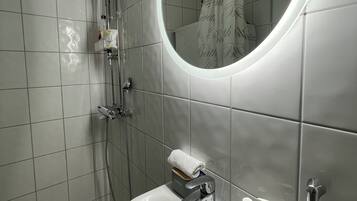 Shower, free toiletries, hair dryer, bathrobes