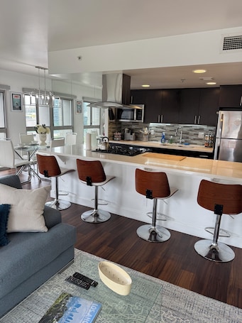 Interior. Cozy 2-bedroom corner unit skyrise apartment with city views