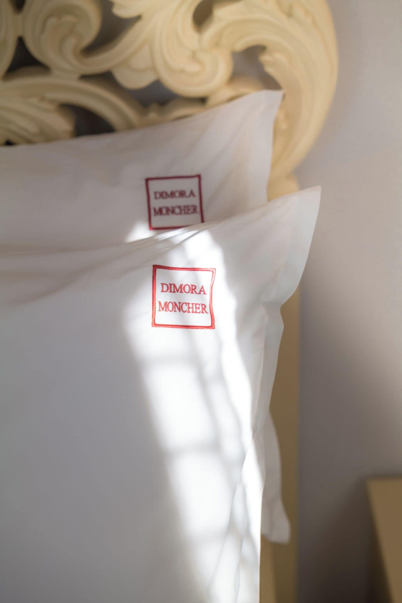 A pillow with a brand label.