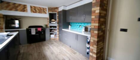 Fridge, stovetop, toaster, cookware/dishes/utensils