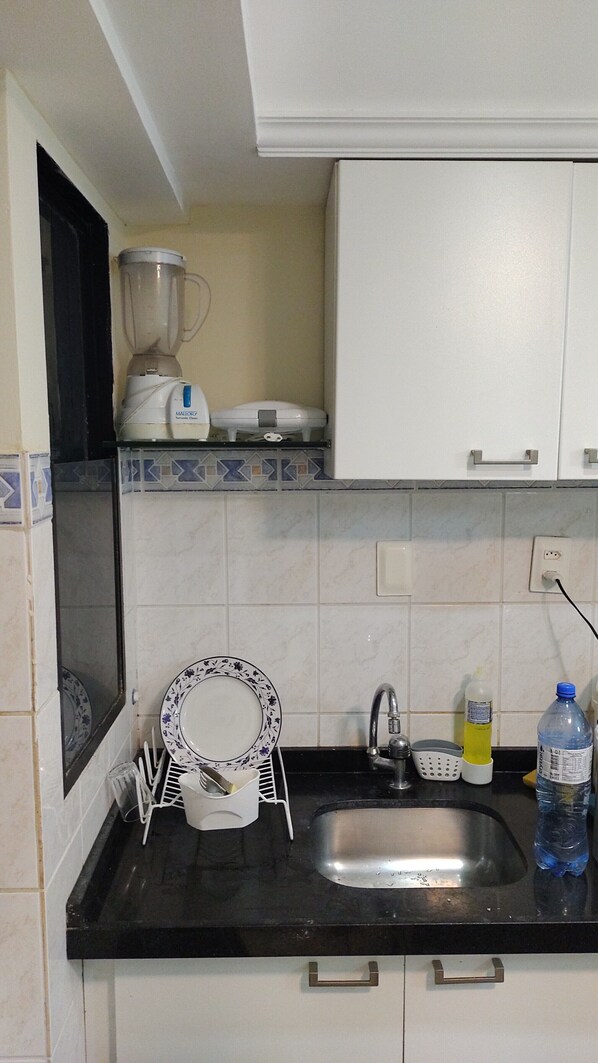 Fridge, microwave, stovetop, cookware/dishes/utensils