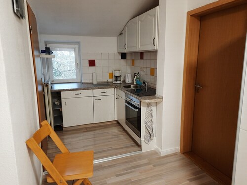 Small vacation apartment with balcony in the attic of a former farmhouse.
