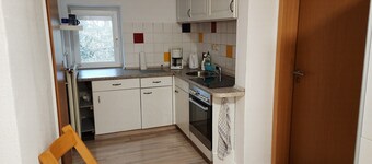 Small vacation apartment with balcony in the attic of a former farmhouse.