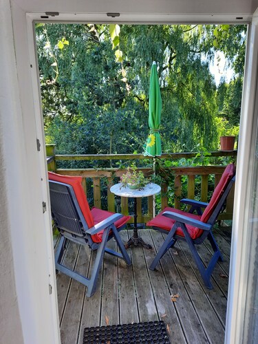 Small vacation apartment with balcony in the attic of a former farmhouse.