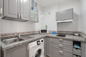 Fridge, microwave, stovetop, coffee/tea maker