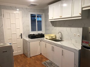 Fridge, microwave, oven, dining tables