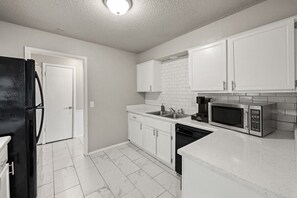 Fridge, microwave, oven, stovetop - Big Value Retreat • Spacious 3BR + Backyard (Oklahoma City)