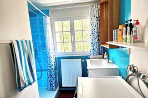 Shower, hair dryer, towels, soap