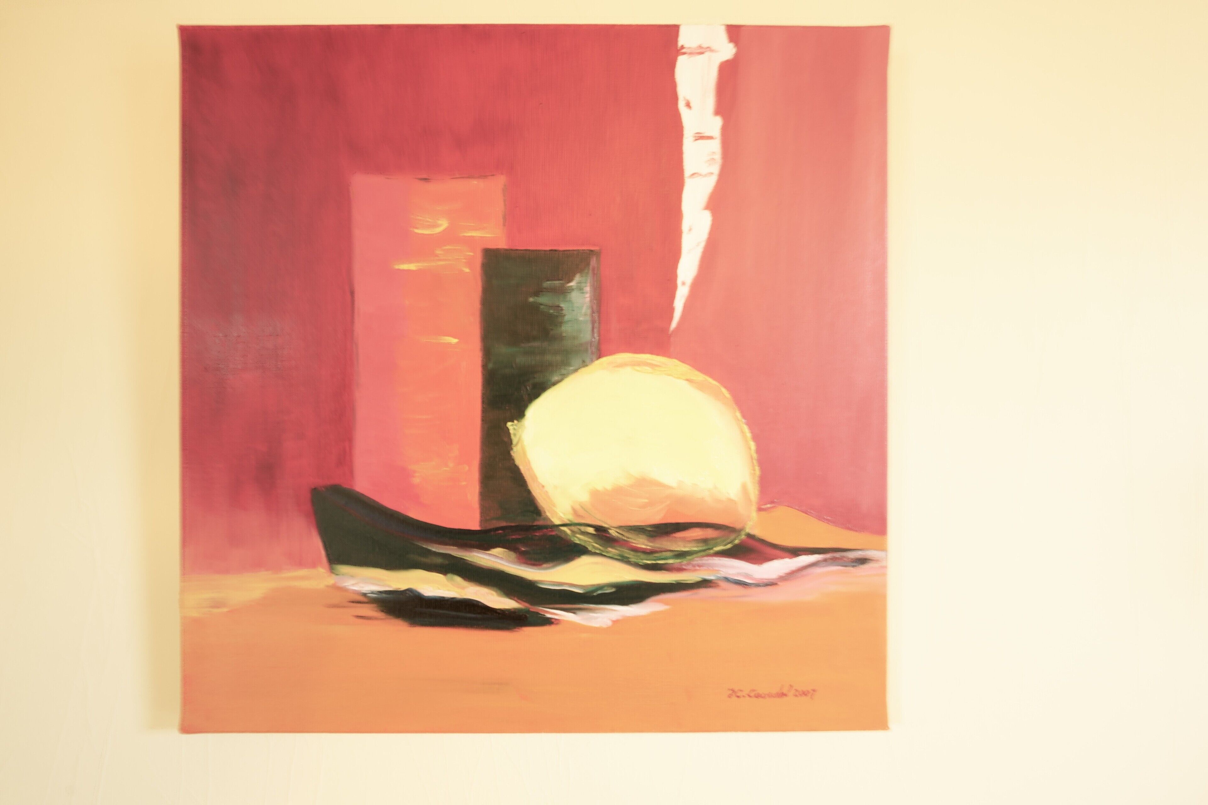 A painting with abstract shapes and a signature.