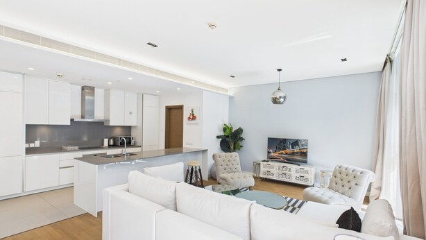 A modern apartment with a kitchen, living area, and dining space. - City Walk 1BR Near Burj Khalifa Dubai Mall (Dubai)