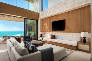 Luxury Room, 5 Bedrooms (Residence) | Living area | 55-inch LED TV with digital channels, books - The Strand Turks and Caicos (Providenciales)