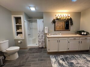 Shower, hair dryer, towels, soap