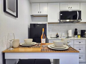Fridge, microwave, stovetop, coffee/tea maker