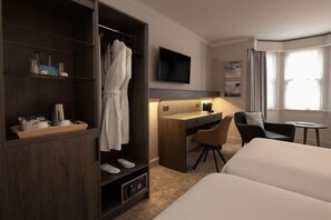 A hotel room with a bed, a desk, a chair, a TV, a wardrobe, and a window. - Bruntsfield Hotel, WorldHotels Elite (Edinburgh)