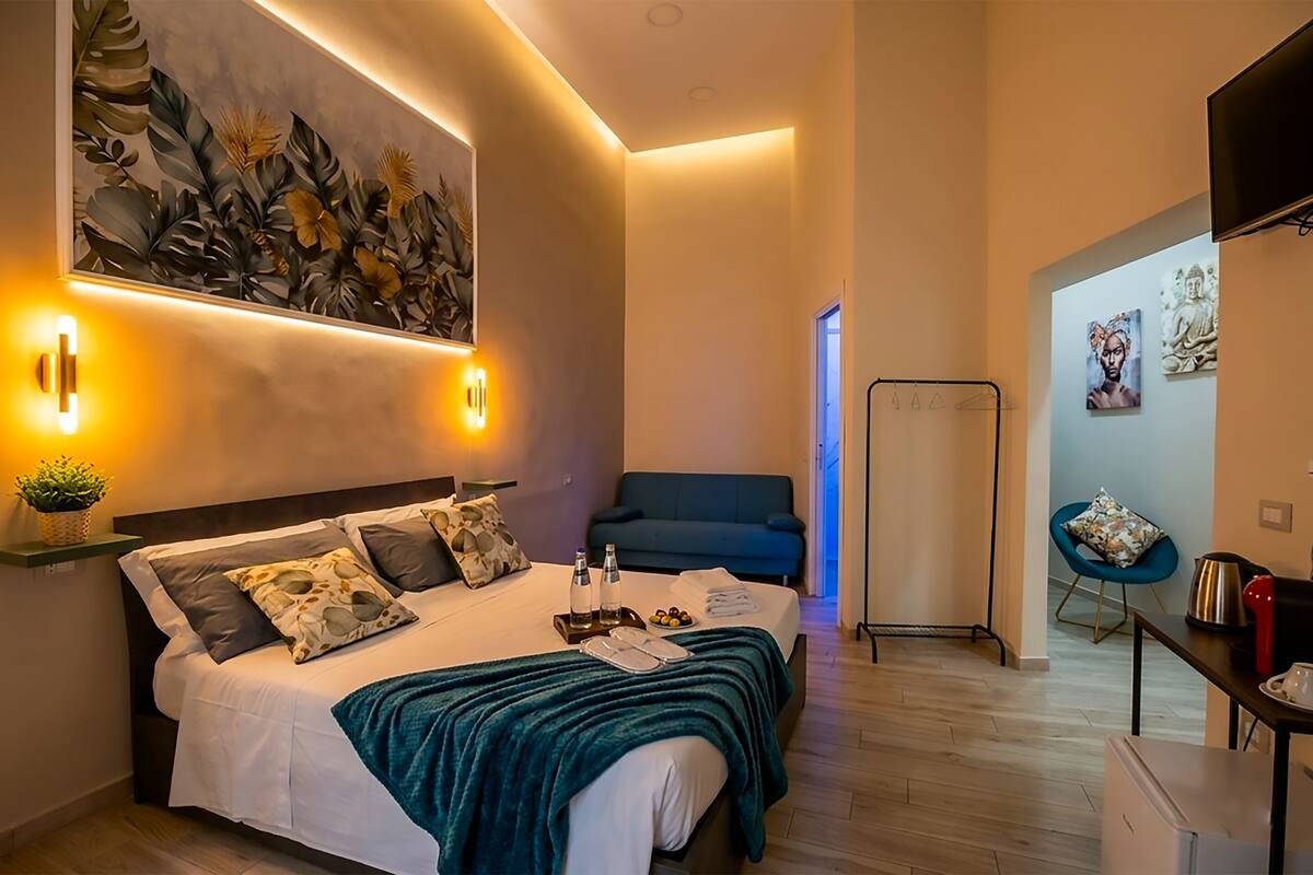 Triple Room, Private Bathroom | Free minibar, in-room safe, blackout curtains, soundproofing
