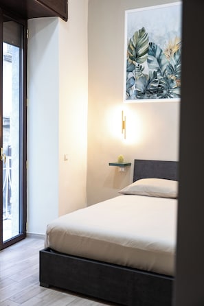 Deluxe Room, Balcony, City View | Free minibar, in-room safe, blackout drapes, soundproofing