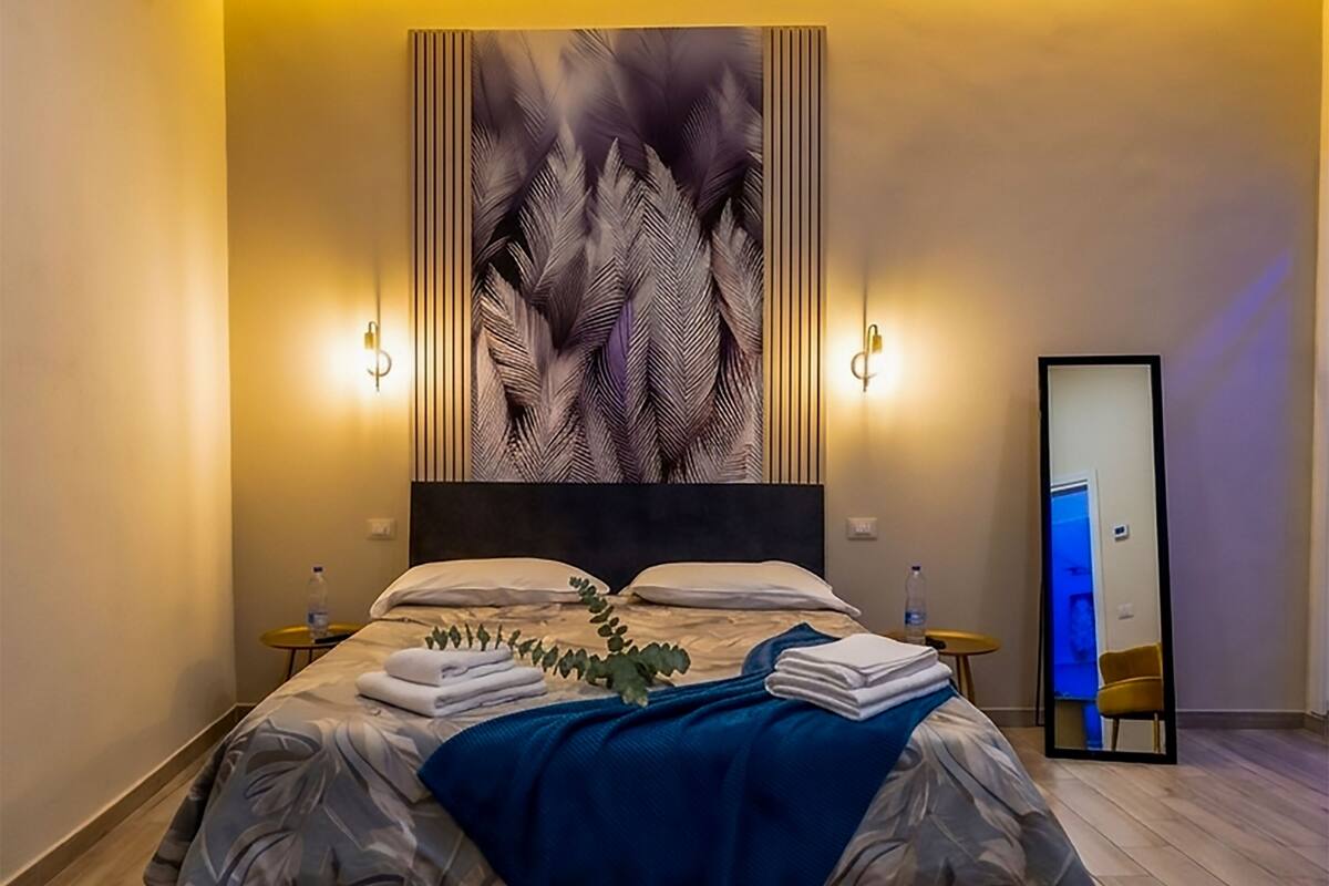 Deluxe Quadruple Room, Private Bathroom | Free minibar, in-room safe, blackout curtains, soundproofing