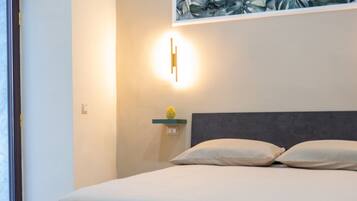 Triple Room, Private Bathroom | Free minibar, in-room safe, blackout drapes, soundproofing