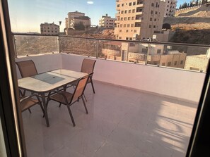 Outdoor dining - 3-bedroom rooftop air conditioned apartment in Amman, Jubaiha, Jordan highway (Amman)