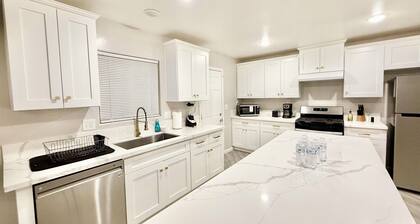 Spacious 4-bedroom house in charming Bakersfield with AC. 4 queen & 3 twin beds.