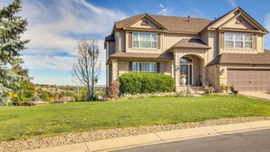 A two-story house with a front entrance, a garage, and a well-maintained lawn. - 4 Mi to Broadmoor! Apt w/ Movie Theater & Mtn View (Colorado Springs)