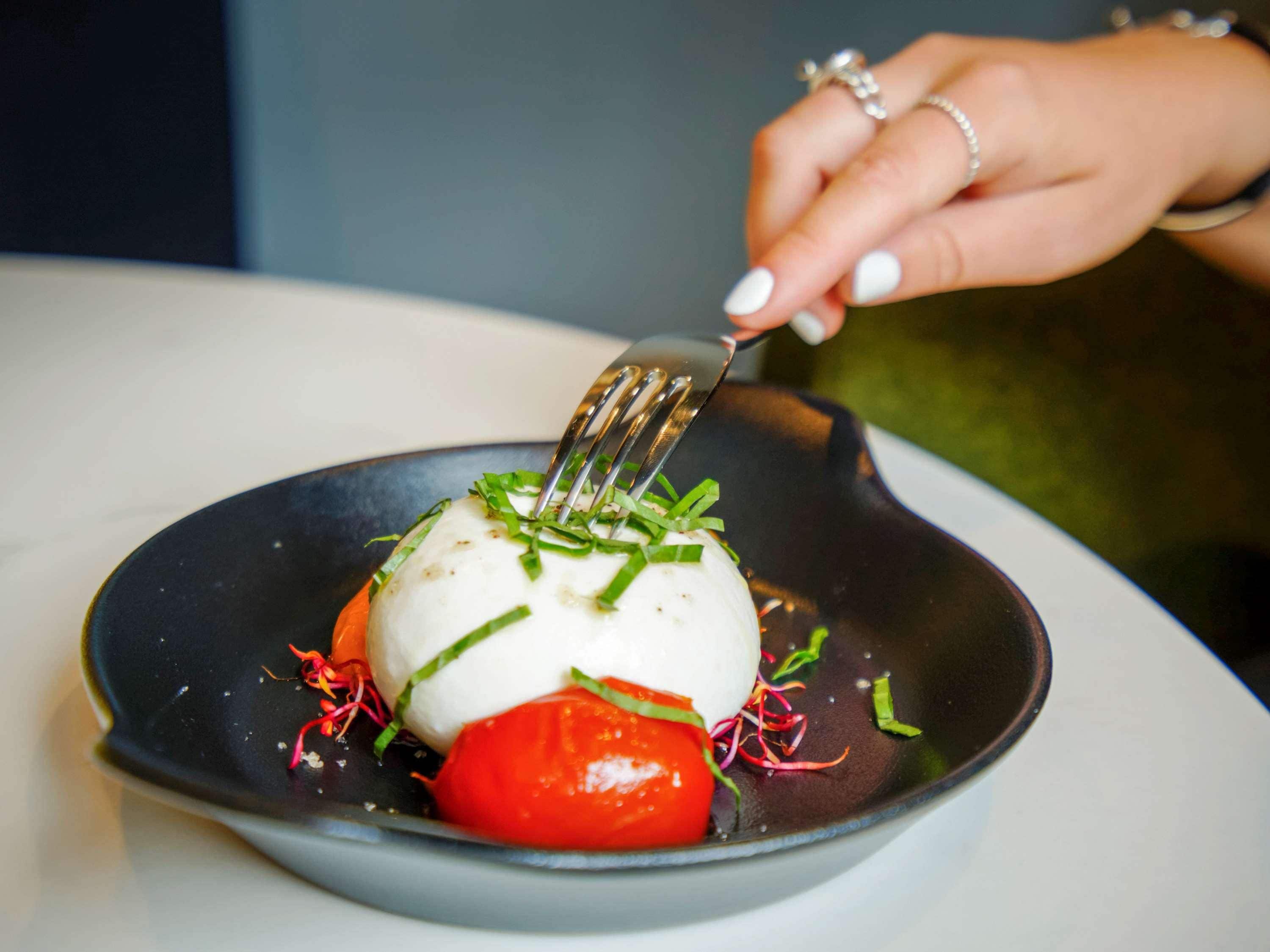 A dish with a fork on a plate.