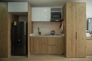 Departamento junior, vista a la ciudad | Cocina privada