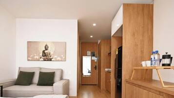 Una sala de estar moderna con un sofá, un cuadro y un mueble de madera con una cafetera.