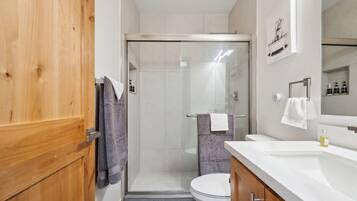 Shower, hair dryer, towels, soap