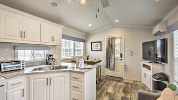 Fridge, microwave, electric kettle, dining table