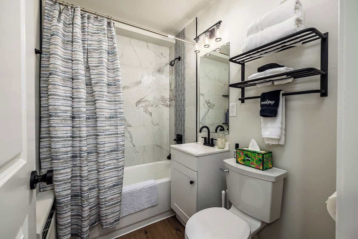 Shower, hair dryer, towels, shampoo