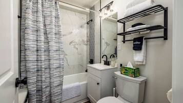 Shower, hair dryer, towels, shampoo