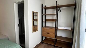 Desk, laptop workspace, blackout drapes, iron/ironing board