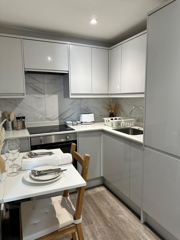 Fridge, electric kettle, toaster, cookware/dishes/utensils