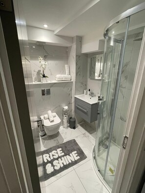 Shower, hair dryer, towels, soap