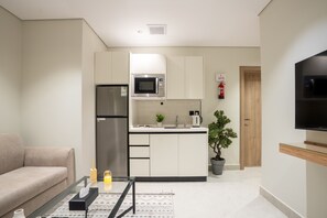 Exclusive Suite, 2 Bedrooms | Living area | 70-inch flat-screen TV with satellite channels - Aljood Residence-BY CH (Madinah)