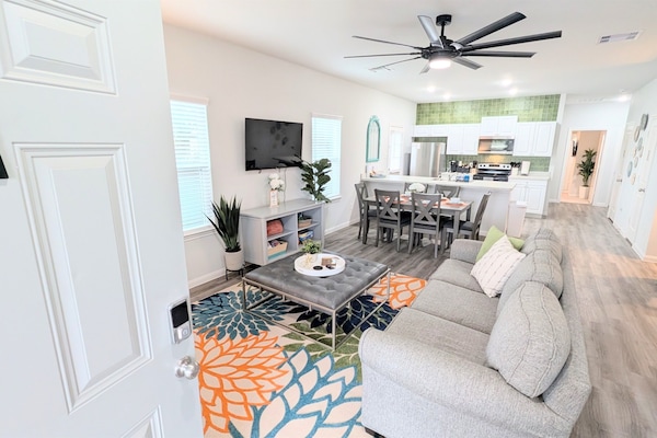 Large, open-concept living, dining, and kitchen area greet you from the step-free doorway making accessibility a breeze.