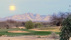 A golf course with sand bunkers and a mountain range in the background. - 55+ 2-bedroom, 2-bathroom Townhouse in The Springs at Santa Rita of Green Valley (The Springs At Santa Rita, Green Valley)