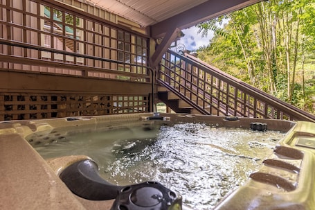 Outdoor spa tub. Cozy 2-bedroom cabin in charming Chatsworth, Georgia