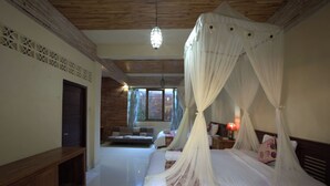 A bedroom with a four-poster bed, a wooden ceiling, and a view of the outside through a window. - Griya Agung Guesthouse Ubud (Ubud)