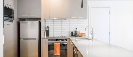 Coffee/tea maker, fridge, microwave, oven