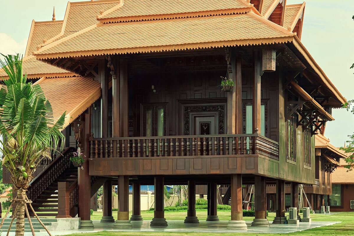 A traditional wooden building with a multi-tiered roof and a balcony.