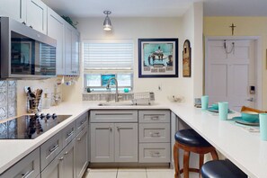 Fridge, microwave, coffee/tea maker - Copa Palms – Canal-Front 1BR with Heated Pool, Dock Access & 5-Min Walk to Treasure Island Beach. (Treasure Island)