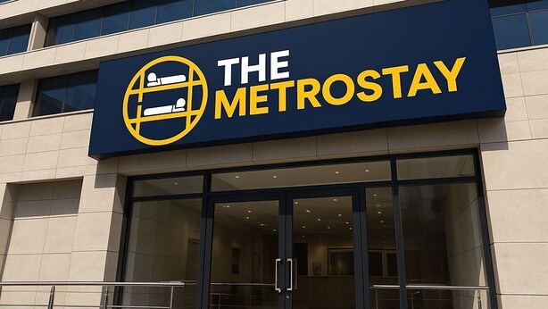 A hotel entrance with a sign reading "The Metrostay" and a globe symbol. - The Metrostay Delhi (New Delhi)