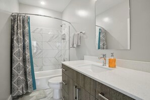 Exclusive Condo, 1 King Bed with Sofa bed | Bathroom | Free toiletries, hair dryer, towels, soap