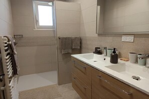 Shower, hair dryer, towels, toilet paper