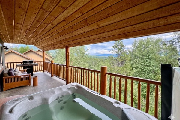 Beautiful private deck with amazing views, seating, Gas BBQ and Private Hot Tub.