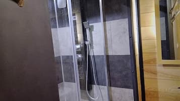 Shower, hair dryer, towels, toilet paper